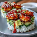 Deconstructed spicy shrimp sushi stack, ready to be enjoyed with a spicy mayo drizzle.