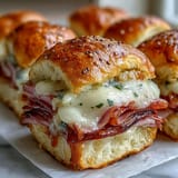 Savory Pear Ham and Cheese Lunchbox Sliders served warm, a perfect easy snack.