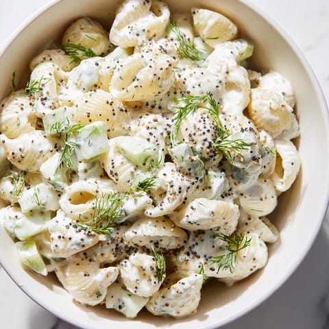 Cucumber Crunch Pasta Salad tossed with crisp cucumbers and green onions, finished with a sprinkle of everything bagel seasoning.  