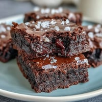 Fudgy sourdough discard brownies with sea salt, topped with flaky crystals for a sweet-salty bite. Rich dark chocolate and a tangy twist from sourdough discard create an indulgent, chewy texture. Warm squares of decadent brownies, fresh from the oven, glistening with melted chocolate and a sprinkle of sea salt. Ultra-moist brownies made with sourdough discard, baked until just set for a fudgy center and crisp edges.