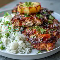 Grilled pineapple chicken and rice foil packets with colorful bell peppers and sweet pineapple chunks. Juicy chicken, tender vegetables, and fluffy rice in a savory honey-garlic marinade. Healthy and easy summer dinner cooked in foil for minimal cleanup and bold tropical flavors.